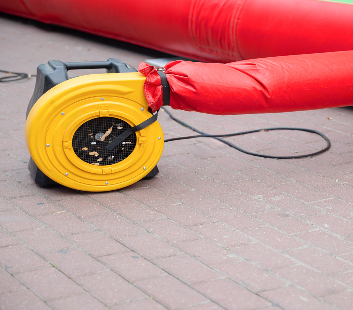 Yellow air blower with red inflatable tube.