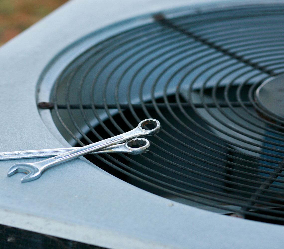 Repair tools atop air conditioner
