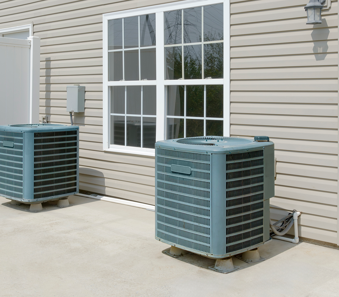 Residential HVAC units on concrete slab